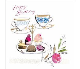 Two Teacups And A Plate Of Cake And Flowers