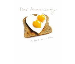 Two Heart Shaped Fried Eggs On Slice Of Toast