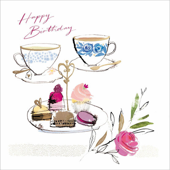 Two Teacups And A Plate Of Cake And Flowers
