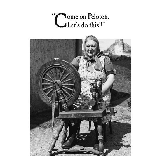 Woman Sat With Old Fashioned Spinning Wheel