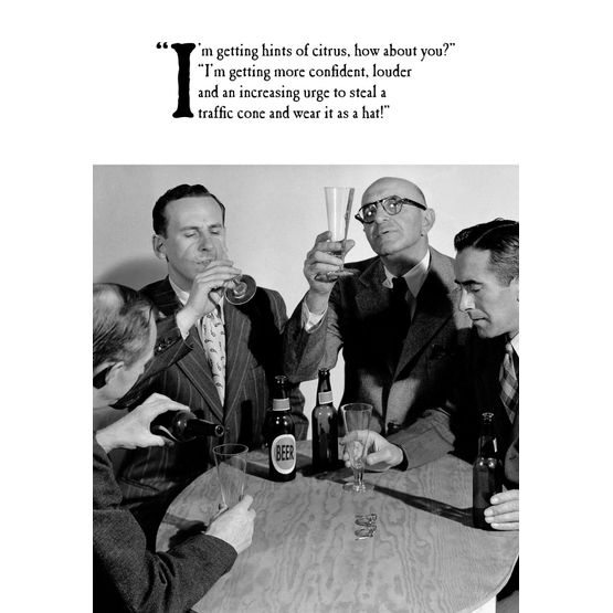 Group Of Males Sitting Around Table Drinking